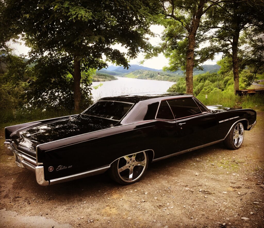 Buick car parked near a river